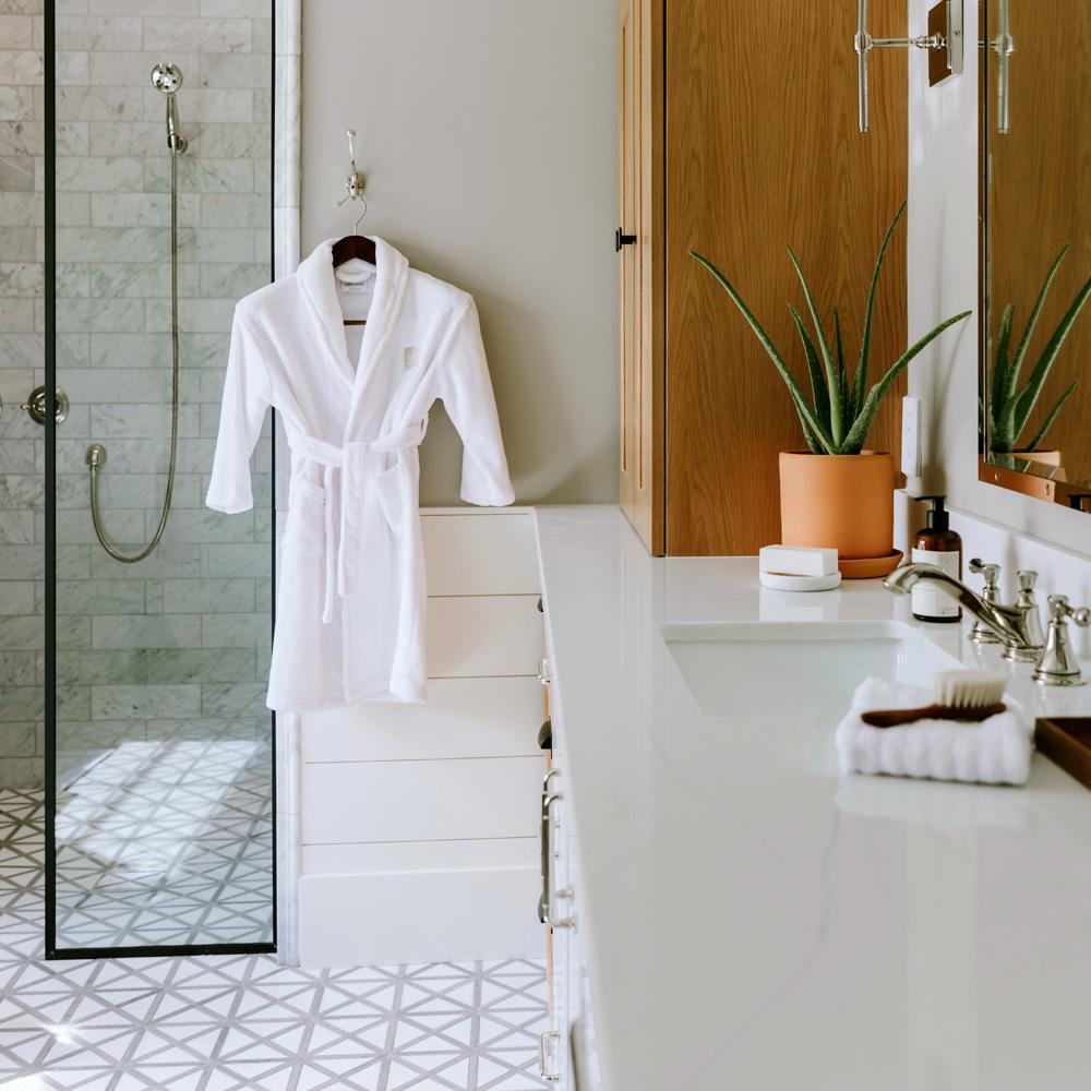 Kids robe hanging by the shower