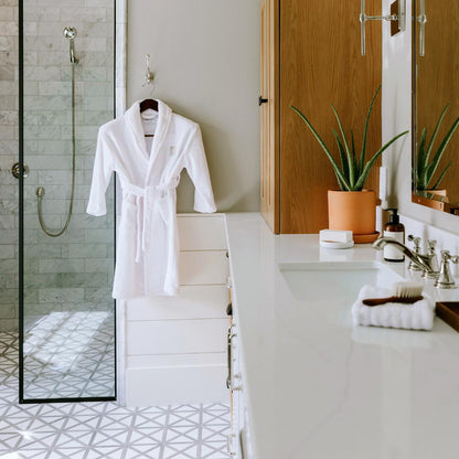 Kids robe hanging by the shower