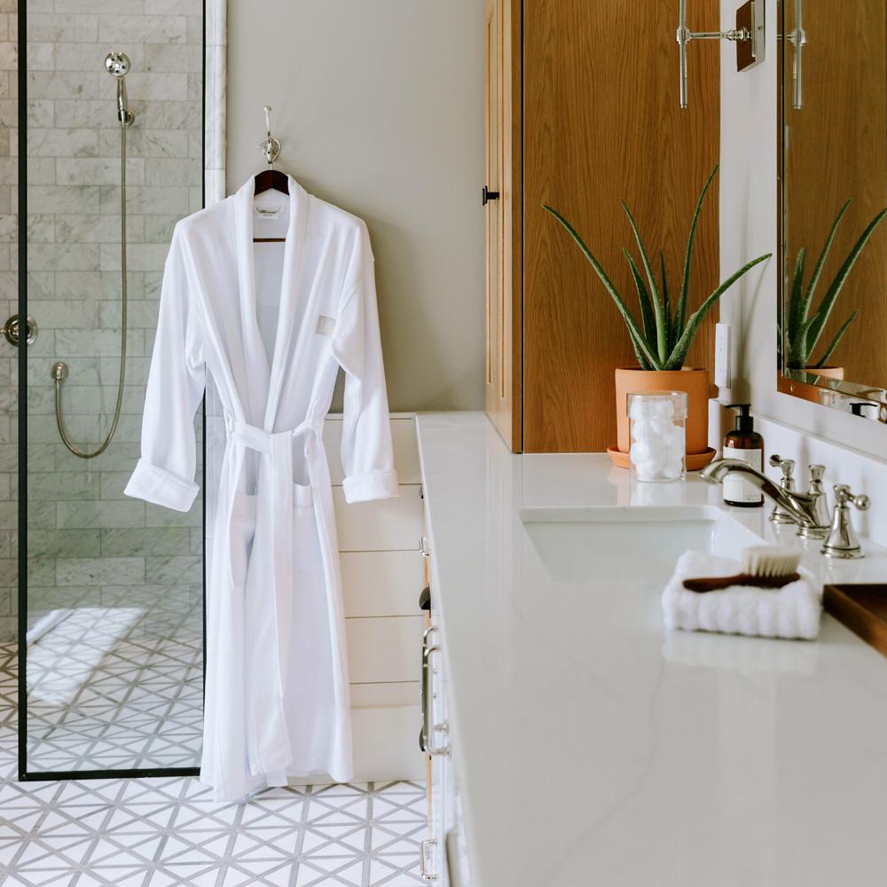 Waffle robe hanging by the shower